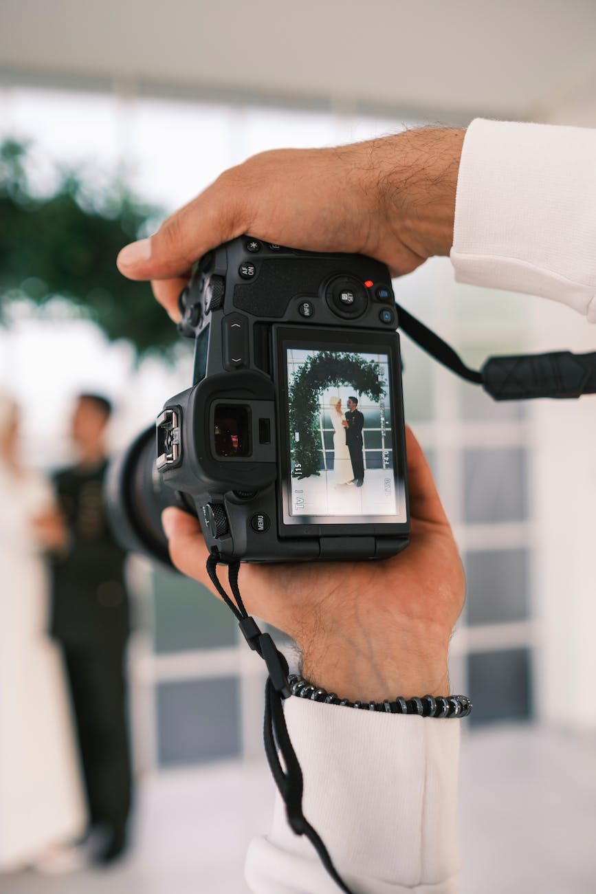 close up of a viewfinder of a camera photographing bride and groom