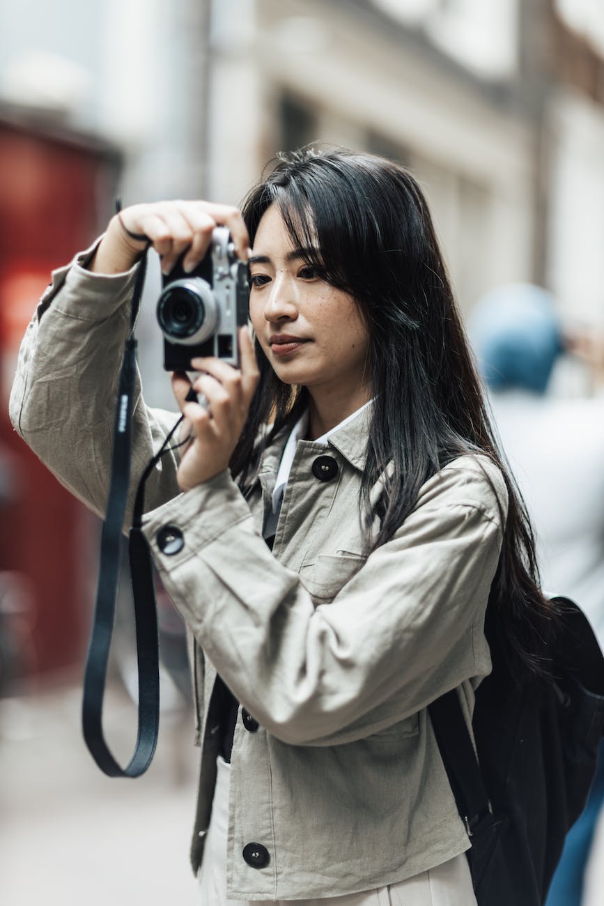 woman taking a photo with her camera