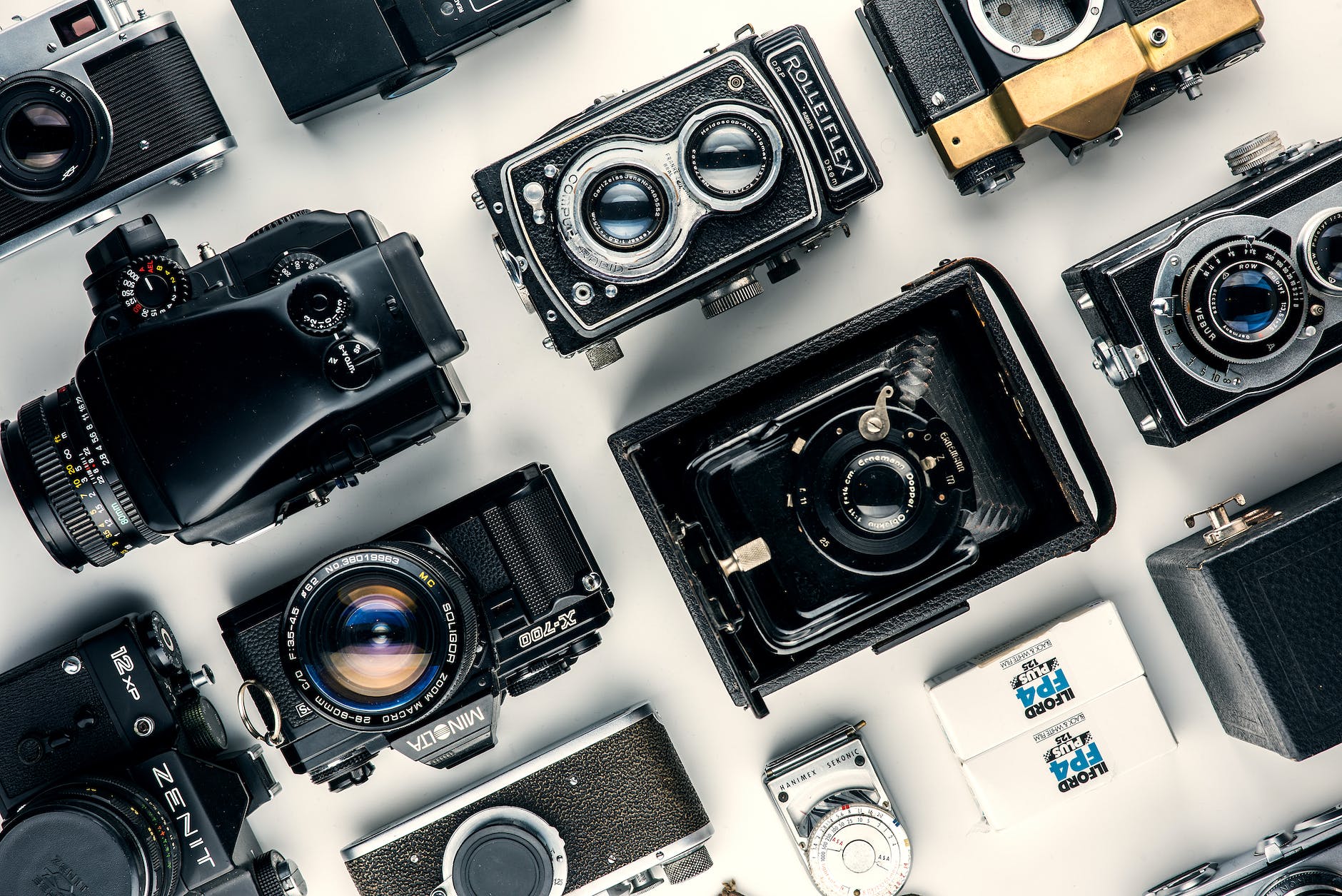 assorted black and gray cameras
